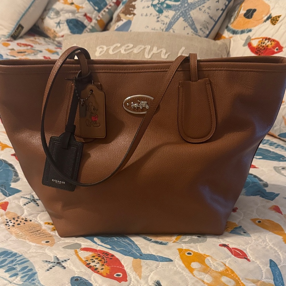 Coach Tan Leather Taxi Tote with Logo  and Disney Hangtags- new without tags.